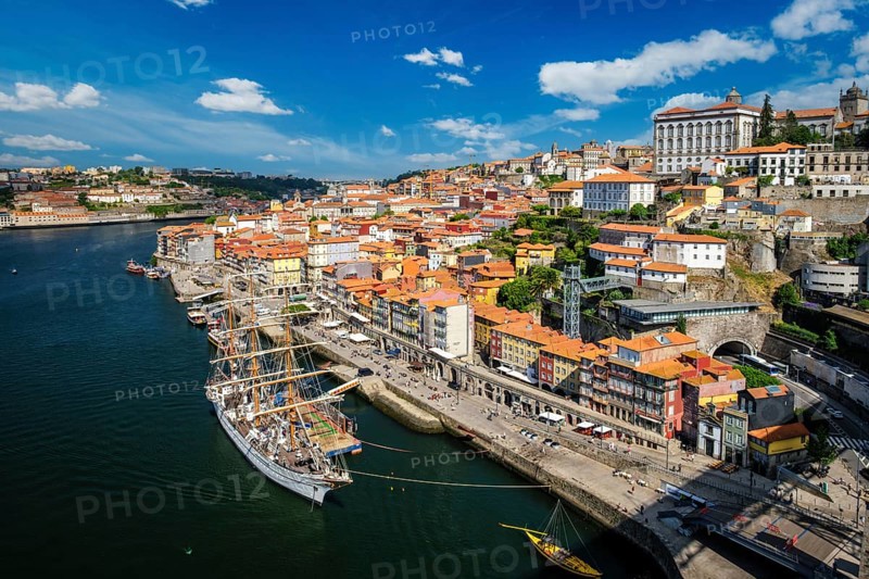 Aerial view of Porto city and Douro river with moored sailling ship from Dom Luis bridge I. Porto, Portugal, Europe