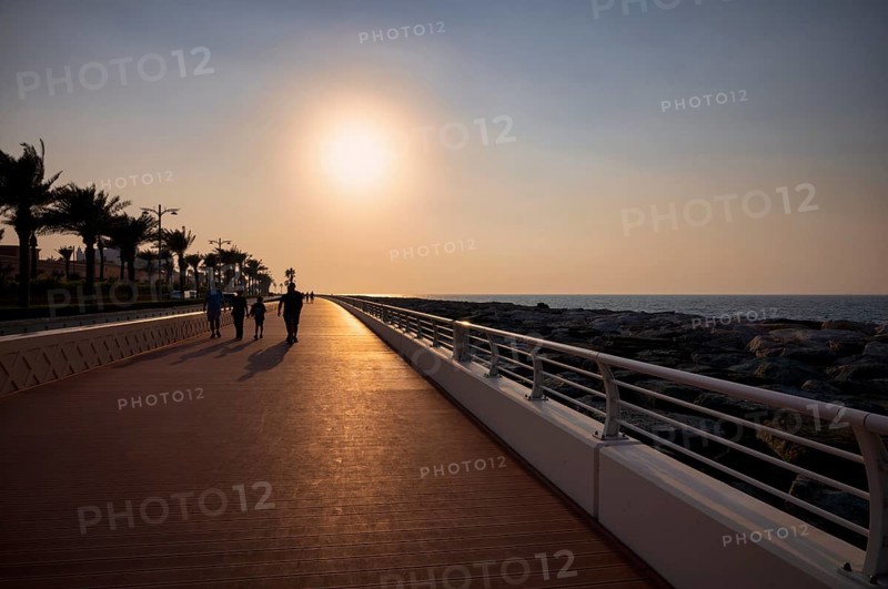 Sunset, walker, The Boardwalk, waterfront promenade, Palm Jumeirah, Dubai, United Arab Emirates, VAR, Asia