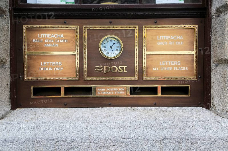 Letter boxes and clock outside the General Post Office, O' Connell Street, Dublin city centre, Ireland, Republic of Ireland, Europe
