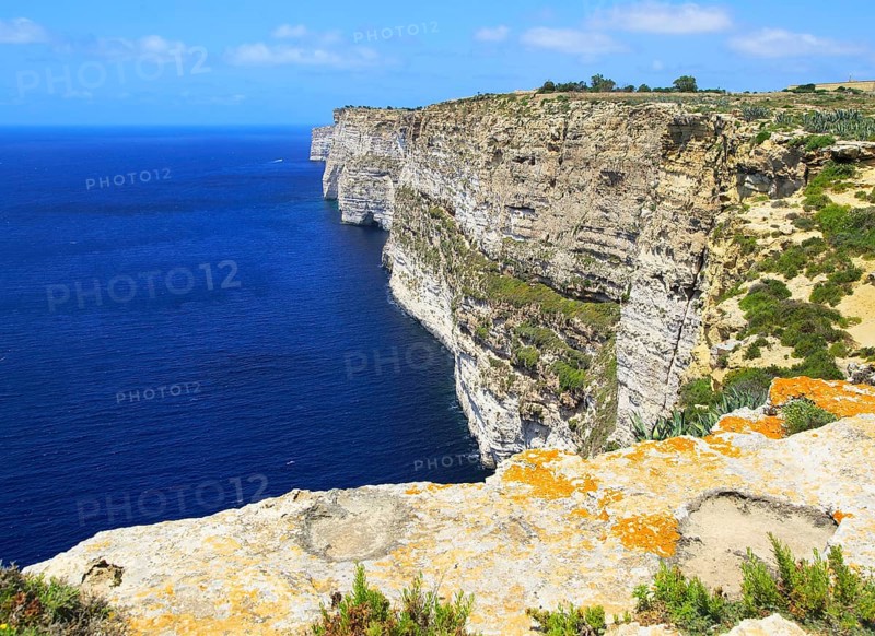 Coastal clifftop landscape view westwards at Ta' Cenc cliffs, island of Gozo, Malta, Europe