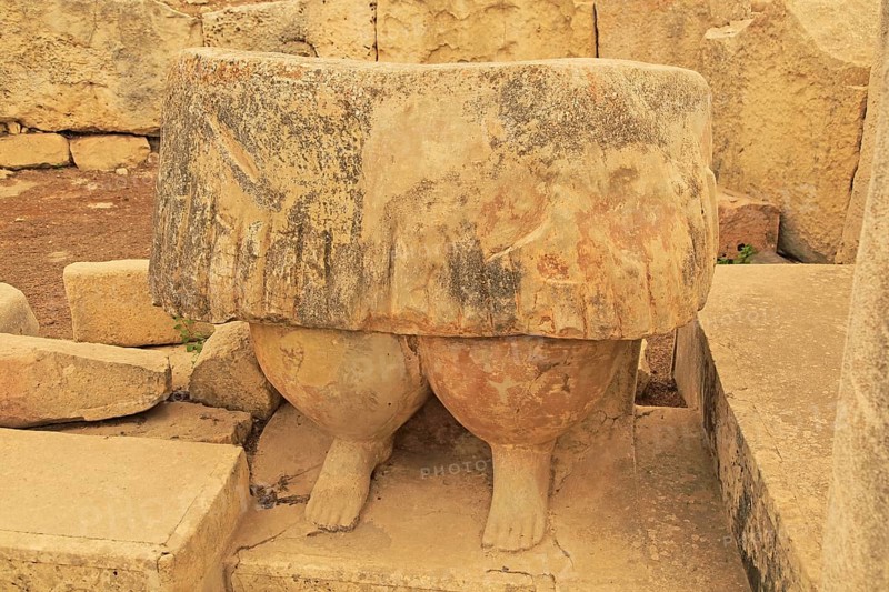 Tarxien neolithic megalithic prehistoric temple complex site, Malta, statue of skirt and legs of fat human figure, Europe