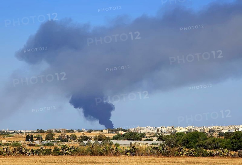 Smoke clouds atmospheric pollution from large fire at recycling centre, Malta, 22 May 2017, Europe