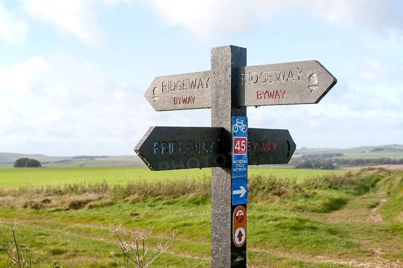 Direction arrow signs on the prehistoric Ridgeway long distance route way, near Overton Hill, Marlborough Downs, Wiltshire, England, UK