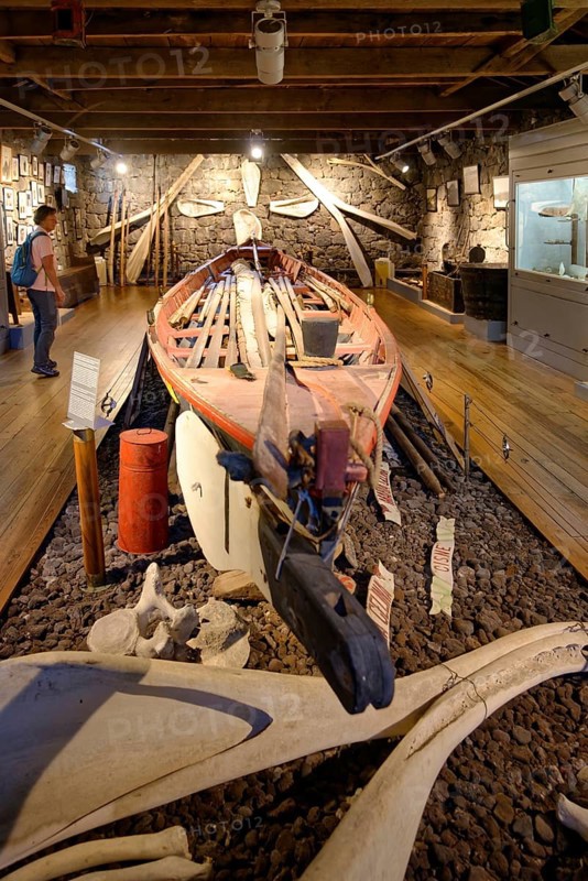 Interior view of the whaling museum of Lajes do Pico with a boat, whale scaffolding and information posters on the wall, Whaling Museum Lajes do Pico, Lajes, Pico, Azores, Portugal, Europe