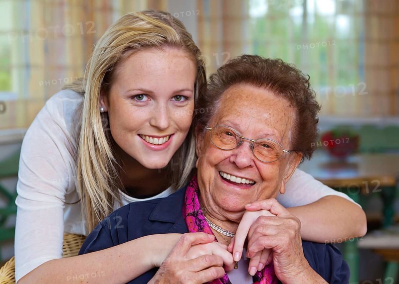 A grandson visits his grandmother Fun and joy while hugging, Vienna, Austria, Europe