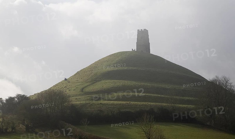 Contre jour view of St Michael's Tower on Glastonbury Tor, Somerset, England, United Kingdom, Europe