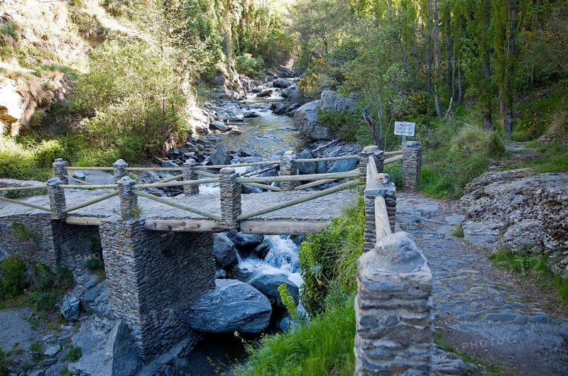 Bridge crossing the River Rio Poqueira gorge valley, High Alpujarras, Sierra Nevada, Granada Province, Spain, Europe
