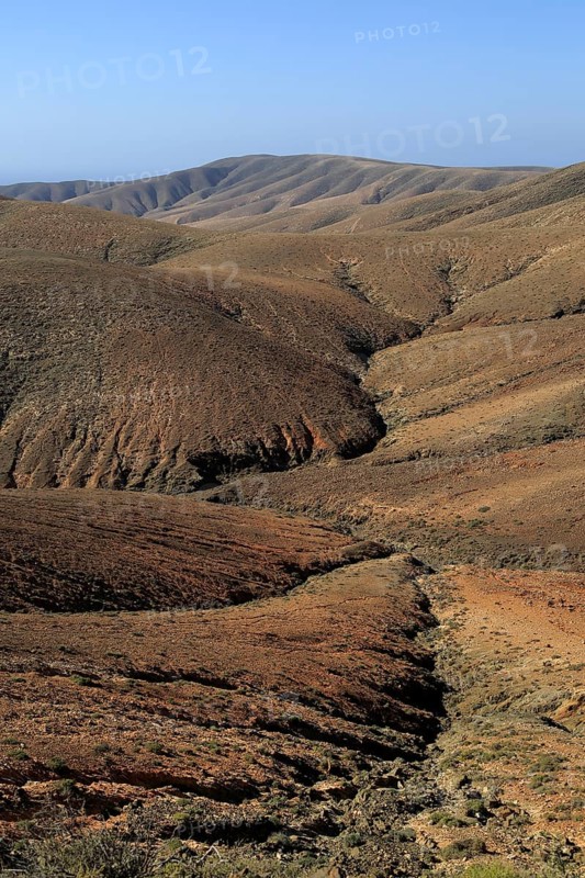 Bare moon-like arid landscape in mountains between Pajara and La Pared, Fuerteventura, Canary Islands, Spain, Europe