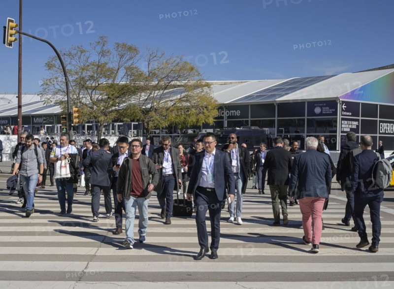 Visitors outside the exhibition centre, MWC Mobile World Congress 2024, Barcelona, Spain, Europe