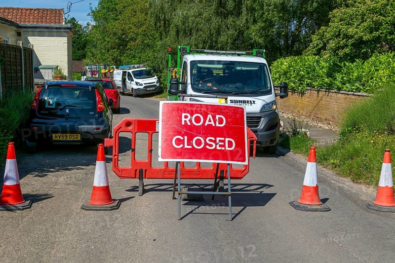 Road Closed sign due to BT maintenance work in street, Shottisham, Suffolk, England, UK