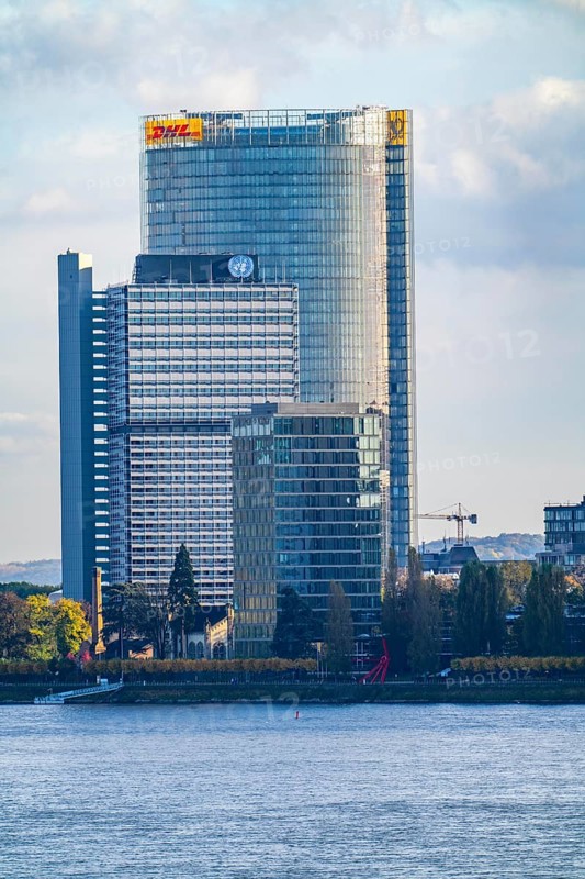 Skyline Bonn on the Rhine, in front the UNFCCC Secretariat of the Framework Convention on Climate Change, in the centre the high-rise building of the United Nations, Campus Bonn, behind it the Posttower, corporate headquarters of Deutsche Post, North Rhine-Westphalia, Germany, Europe