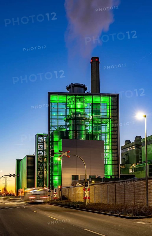 The Lausward combined heat and power plant in Düsseldorf, gas and steam turbine power plant, operated by Stadtwerke Düsseldorf and EnBW, in the harbour of Düsseldorf on the Rhine, green illuminated city window, the chimney of the Fortuna power plant unit, the power plant generates electricity, also traction current and district heating, North Rhine-Westphalia, Germany, Europe