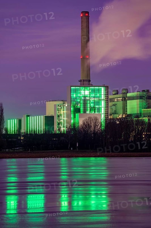 The Lausward combined heat and power plant in Düsseldorf, gas and steam turbine power plant, operated by Stadtwerke Düsseldorf and EnBW, on the Rhine, green illuminated city window, the chimney of the Fortuna power plant unit, the power plant generates electricity, also traction current and district heating, North Rhine-Westphalia, Germany, Europe