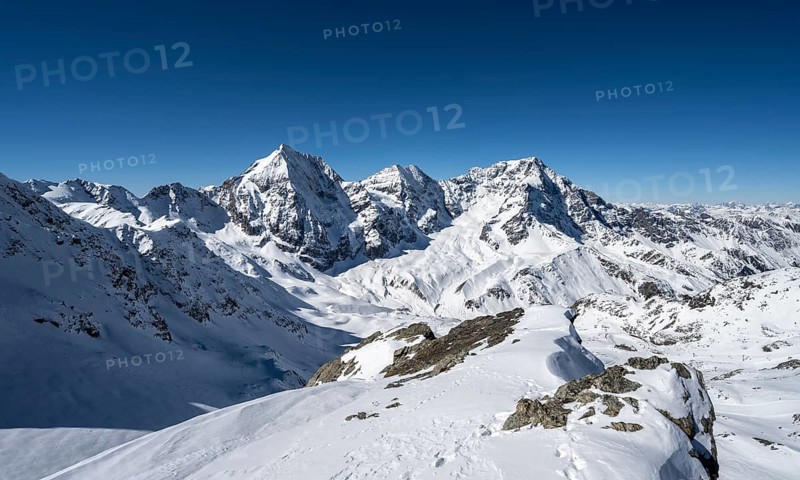 Mountain panorama with snow-covered mountain landscape in winter, view of mountain peaks Königsspitze, Monte Zebru and Ortler, summit of Madritschspitze, Ortler Alps, Vinschgau Valley, Italy, Europe