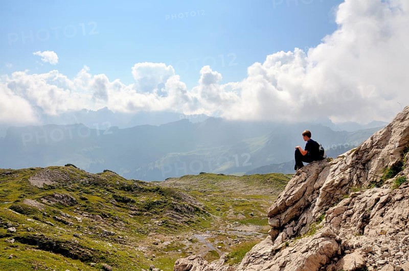 Ten-year-old boy hiking, short rest, Nebelhorn, Allgäu Alps, Bavaria, Germany, Europe