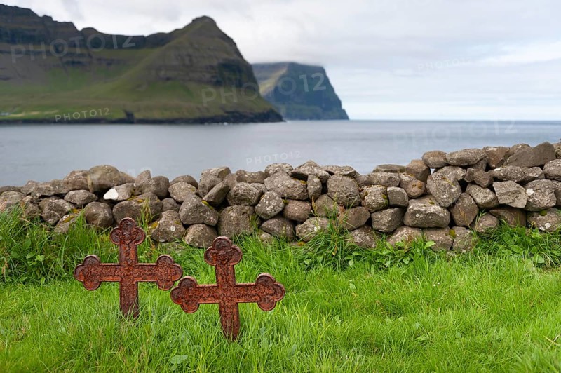 Old iron crosses, stone wall, cemetery, Vidareidi, Vidoy Island, Viðareiði, Viðoy Island, Faroe Islands, Denmark, Europe