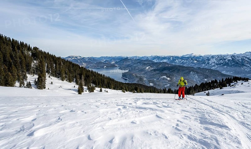 Ski tourers climbing Simetsberg, view of Walchensee, Estergebirge, Bavarian Prealps, Bavaria Germany