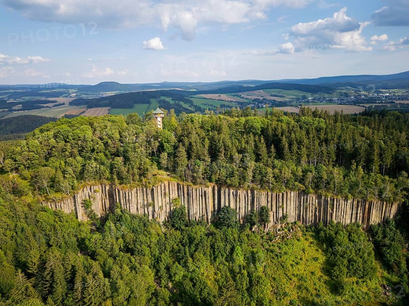 The Scheibenberg is a mountain in the Ore Mountains in Saxony with an altitude of 807.2 metres above sea level. It is located directly south-east of the town of Scheibenberg in the Erzgebirge district of the same name. Together with the Bärenstein and the Pöhlberg, the mountain is one of the three large basalt mountains in the Westerzgebirge. Due to its significance as one of the most important geological monuments in Germany, the Scheibenberg geotope is an associated site of the Erzgebirge/Krušnohorí mining region, which has been a UNESCO World Heritage Site since 2019., Scheibenberg, Scheibenberg, Saxony, Germany, Europe