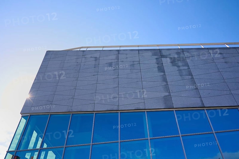 Modern building More og Romsdal Art Centre with glass front and reflecting blue sky, Molde, Romsdal, Norway, Europe