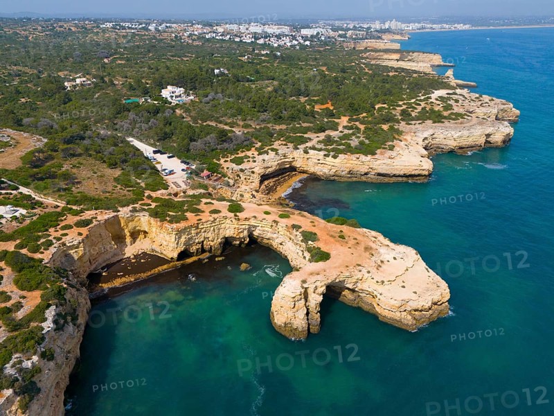 Coastline with rocky cliffs and green vegetation, fringing the blue sea, aerial view, Arco de Albandeira, Lagoa, Algarve, Portugal, Europe