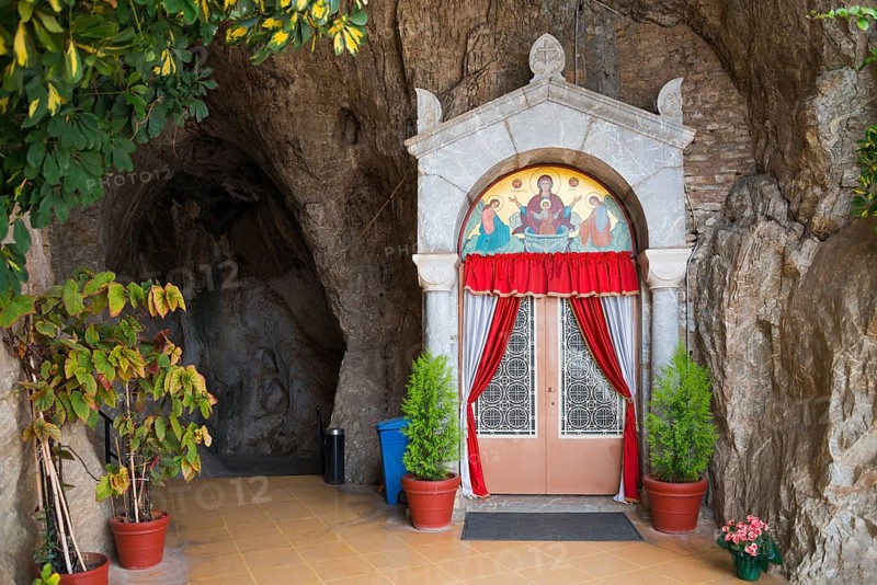 Church entrance in rock face with red curtains and icons, Church of Mary the Fountain of Life, Zoodochos Pigi, rock church, Kefalari, Argolis, Peloponnese, Greece, Europe