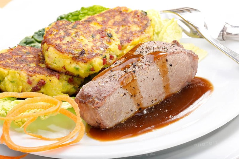 Swabian cuisine, medallions of wild boar with savoy cabbage cakes, meat dish, roasted, hearty, home cooking, typical Swabian, arranged on a plate, traditional cuisine reinterpreted, food photography, studio, Germany, Europe
