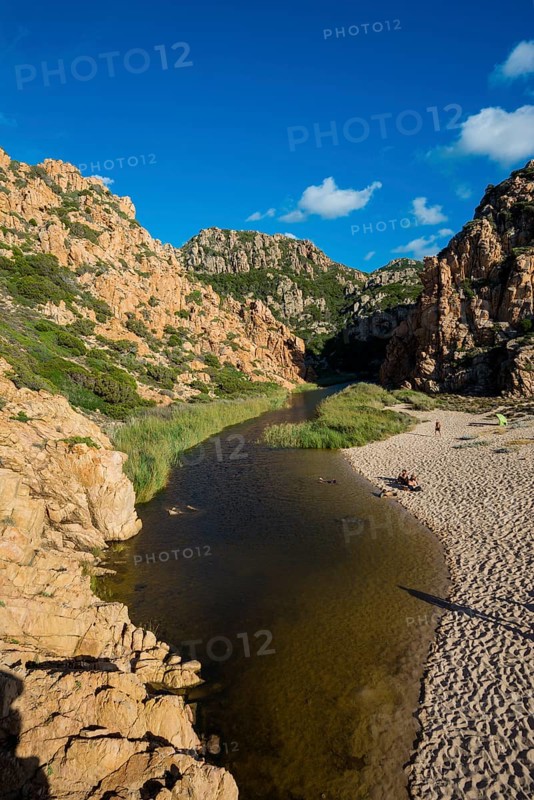 Red rocks and picturesque beach, Spiaggia di Cala li Cossi, Costa Paradiso, Sardinia, Italy, Europe