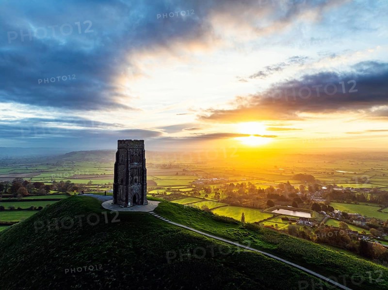 Sunrise over Glastonbury Tor from a drone at autumn, Glastonbury, Somerset, England, United Kingdom, Europe