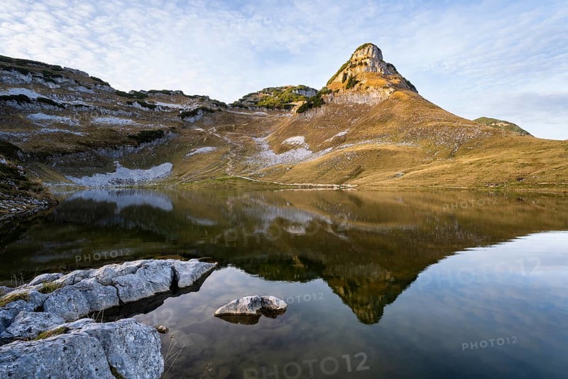 Lake Augstsee and the Atterkogel mountain on the Loser. Autumn, good weather, blue sky, little clouds. In the evening. Reflection. Altaussee, Bad Aussee, Ausseer Land, Totes Gebirge, Styria, Upper Austria, Austria, Europe