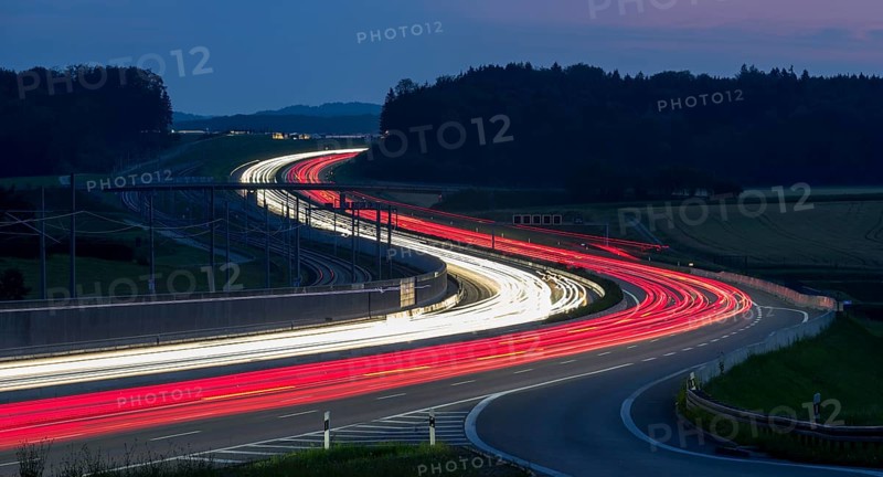 Tracers on the A8 motorway, winding road, evening, long exposure, Swabian Alb, Baden-Württemberg, Germany, Europe