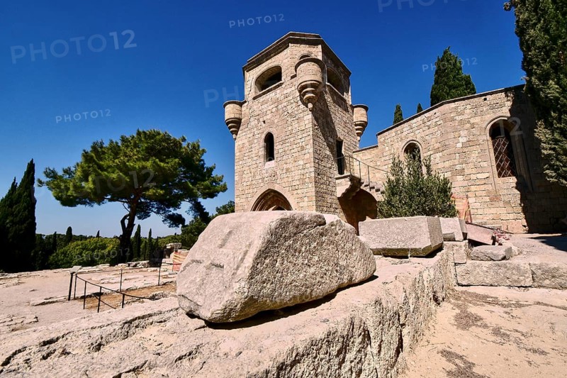 Monastery of Our Lady of Mount Filerimos, A medieval stone tower on a sunny day surrounded by cypresses, Filerimos, hill not far from Rhodes town, Ancient State of Ialyssos, Rhodes, Dodecanese, Greek Islands, Greece, Europe