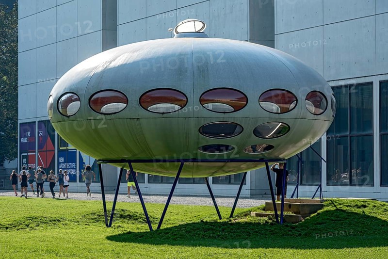Futuro, Futuro House, round house made of plastic by Matti Suuronen, futuristic functional, UFO, people running during early morning exercise, meadow at Museum Pinakothek der Moderne, Munich, Upper Bavaria, Bavaria, Germany, Europe