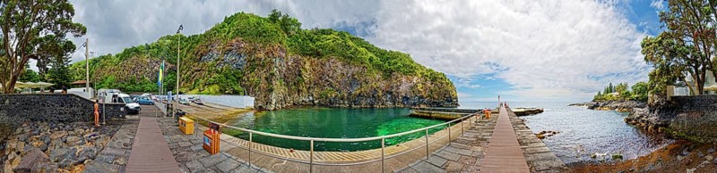 360° view, wooden walkway leading to green rocky coast and clear ocean under blue sky with clouds, fishing village Caloura, Ribeira Chã, Sao Miguel Island, Azores, Portugal, Europe