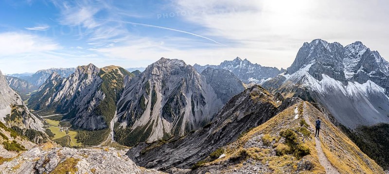 Panorama, view into Falzthurntal, mountaineer on a hiking trail on the ridge of Hahnkampl, mountain panorama with rocky steep peaks, view of summit Lamsenspitze, Karwendel Mountains, Alpenpark Karwendel, Tyrol, Austria, Europe