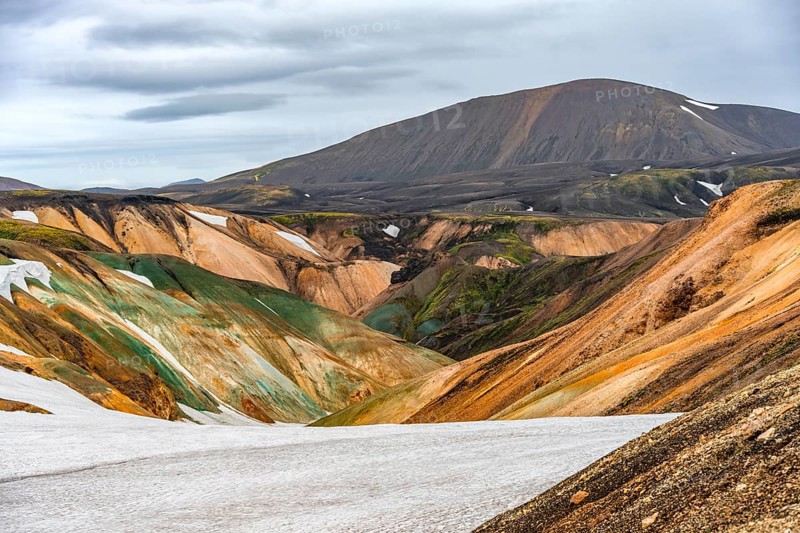 Colourful volcanic landscape with hills and snow, Laugavegur trekking trail, Landmannalaugar, Fjallabak Nature Reserve, Icelandic Highlands, Suðurland, Iceland, Europe