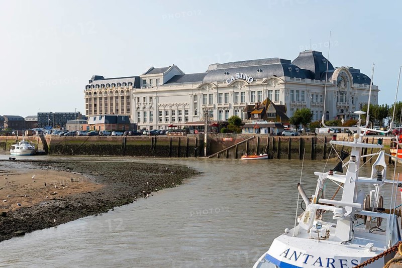 Large historic riverside building with boats in the foreground, Casino Barrière, casino, Trouville-sur-Mer, Trouville, River Touques, Cœur Côte Fleurie, Honfleur-Deauville, Lisieux, Calvados, Normandy, English Channel, France, Europe