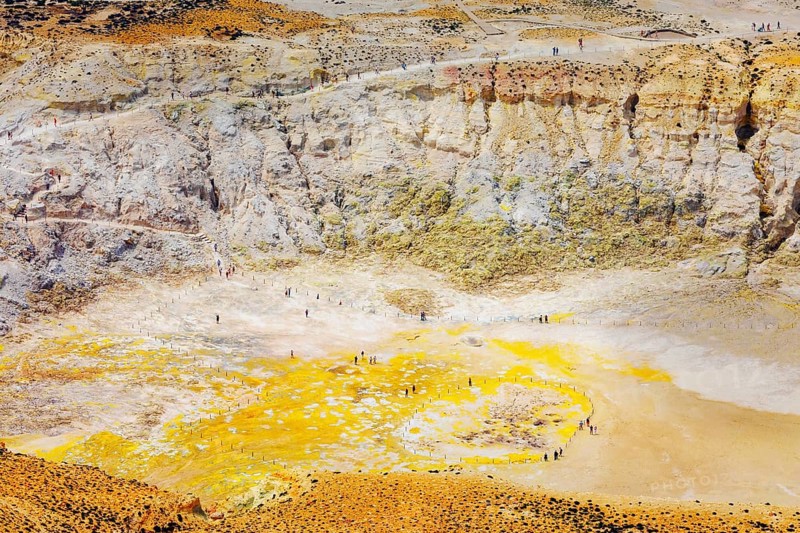 People walking around Stefanos crater moonlike landscape, Nisyros Island, Dodecanese Islands, Greece, Europe
