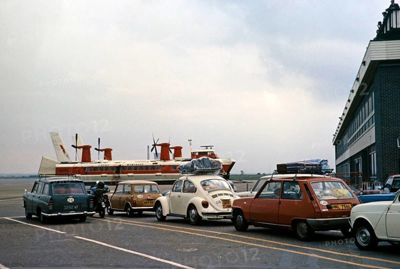 Cars waiting on the quayside for a Hoverlloyd hovercraft to cross the Channel, Ramsgate, Kent, England, UK 1977