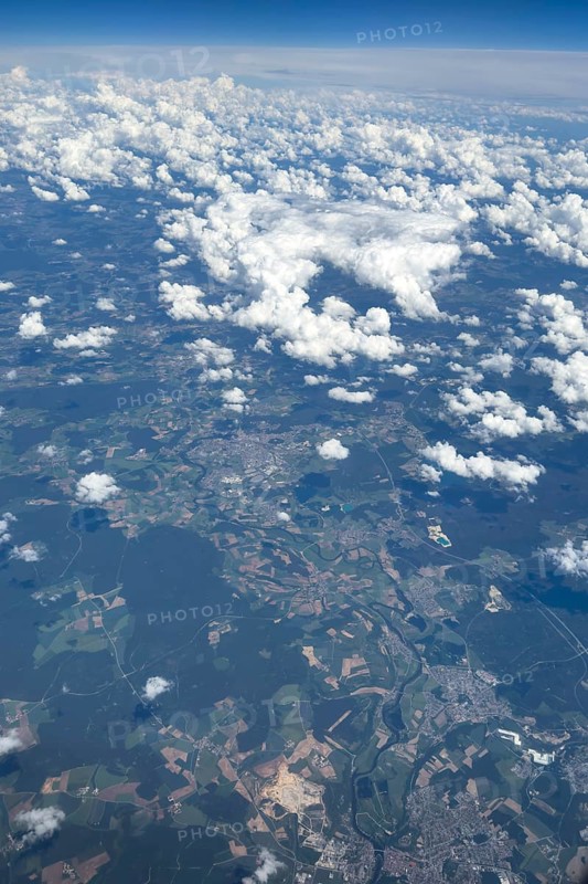 View from an altitude of 11887 metres 39000 feet to white clouds cirrocumulus in the background slightly curved horizon on the ground river Naab, Katzdorf, Teublitz, Bavaria, Germany, Europe