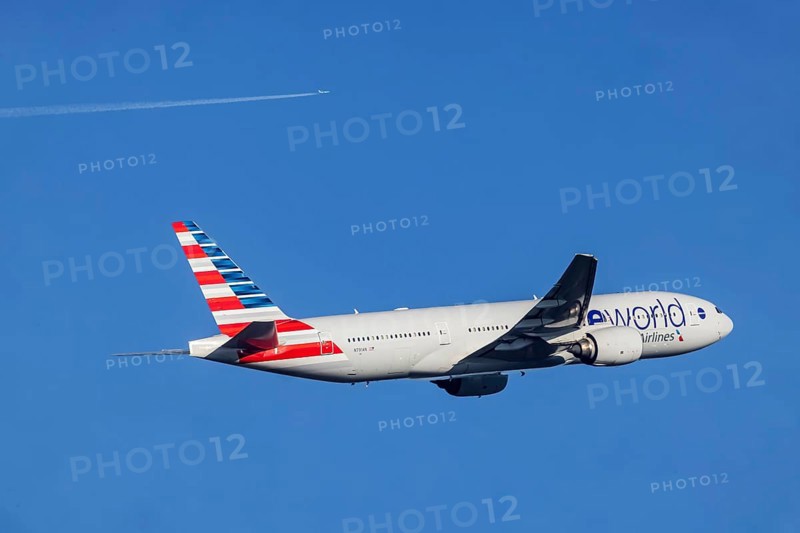 Aircraft climbing after take-off at Fraport Airport. Aircraft registration number: N791AN, Boeing 777, American Airlines, special livery with advertising for the global aviation alliance Oneworld Alliance. Frankfurt am Main, Hesse, Germany, Europe