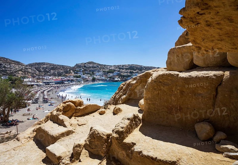 View from the rock caves to the beach of Matala, south coast, Crete, Greece, Europe
