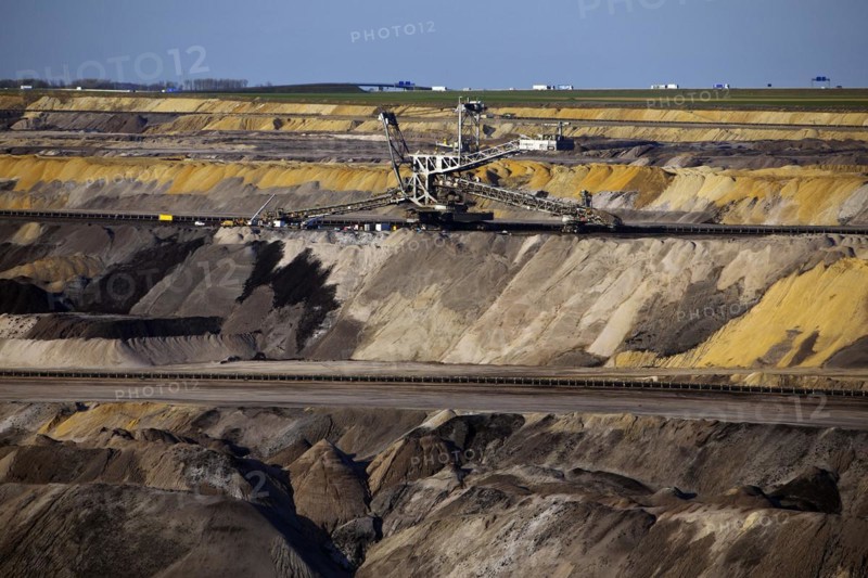 Opencast lignite mine with spreader and motorway in the background, Garzweiler, Jüchen, North Rhine-Westphalia, Germany, Europe