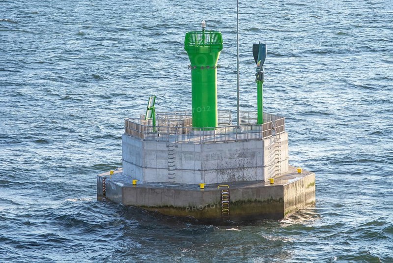 Small lighthouse on navigation mark in Baltic Sea outside Swinoujscie, Poland, Europe