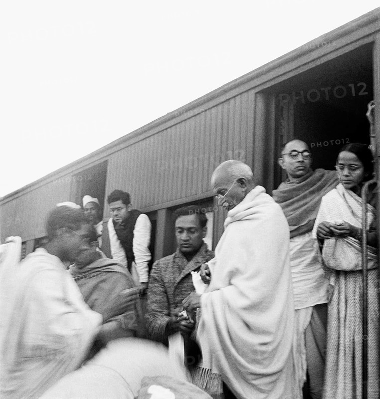 Mahatma Gandhi collecting funds for untouchables at a train station on his way to Assam - MODEL RELEASE NOT AVAILABLE