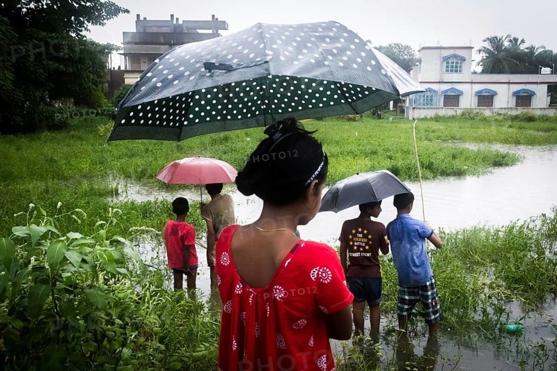 Children standing, monsoon, Barasat, Kolkata, West Bengal, India, Asia