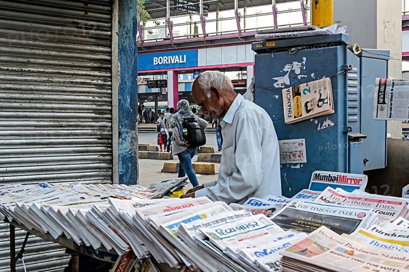 Newspaper vendor at Borivali Railway Station, Mumbai, Maharashtra, India, Asia