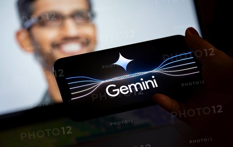 Guwahati, India. 8 December 2023. In this photo illustration a Gemini logo is displayed on a smartphone with Google CEO Sundar Pichai photo displayed in the background