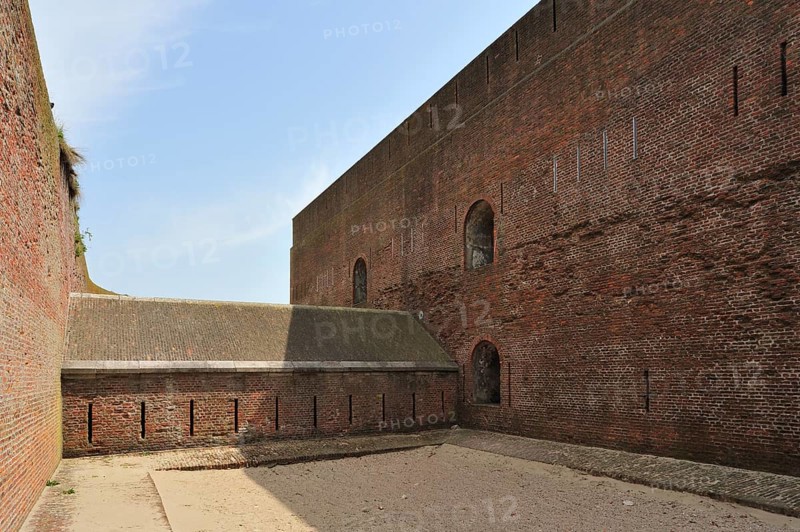 The pentagonal Fort Napoleon with caponier with gun ports and dry ditch in the dunes near Ostend, Belgium, Europe