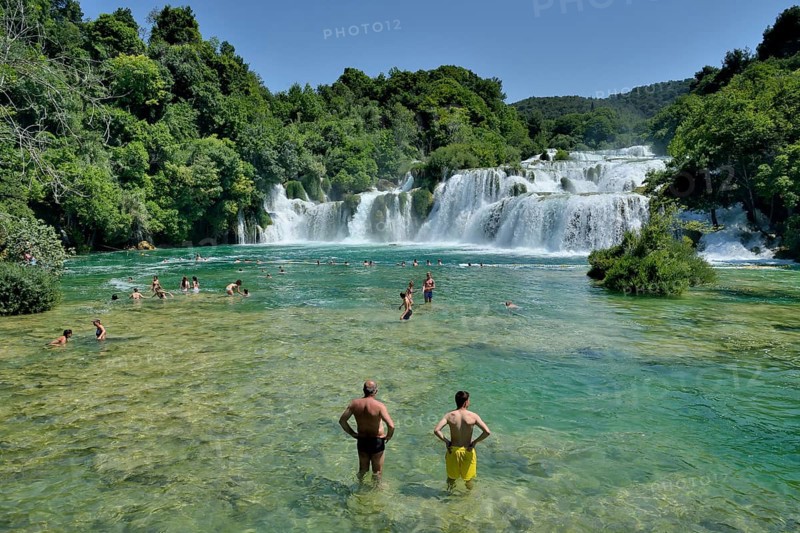 Tourists taking a bath at the Skradinski buk waterfalls, Krka National Park, Šibenik-Knin County, Dalmatia, Croatia, Europe