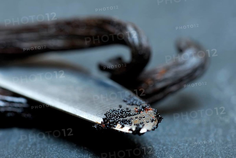 Vanilla sticks, vanilla pulp on knife point (Vanilla planifolia)